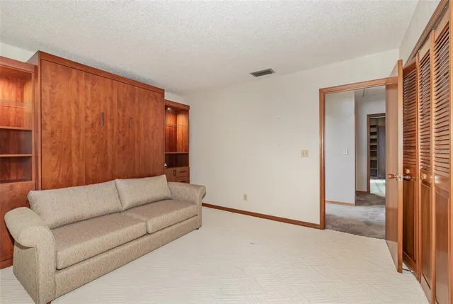 a living room with a couch and a window