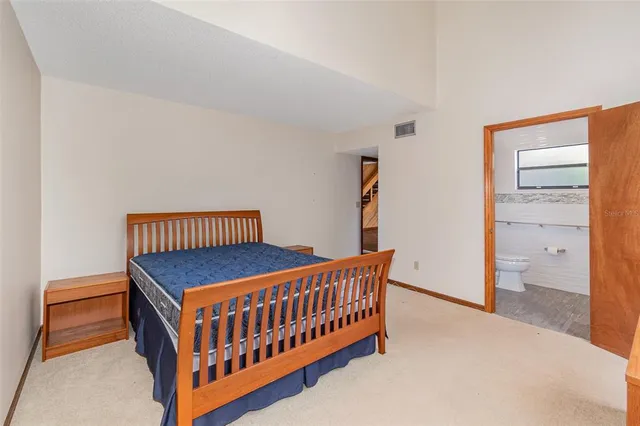 a bedroom with furniture and a window