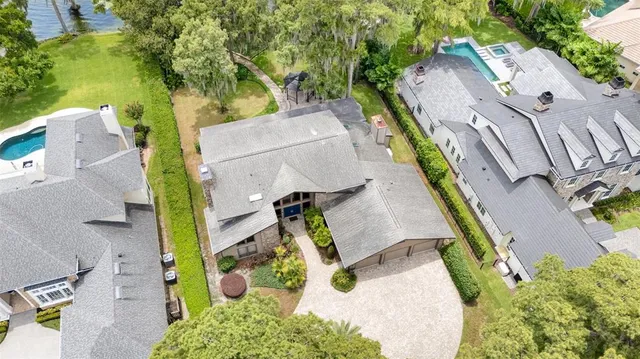 an aerial view of multiple houses with yard