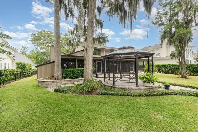 a front view of a house with a yard table and chairs