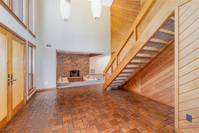 a view of an entryway with wooden floor