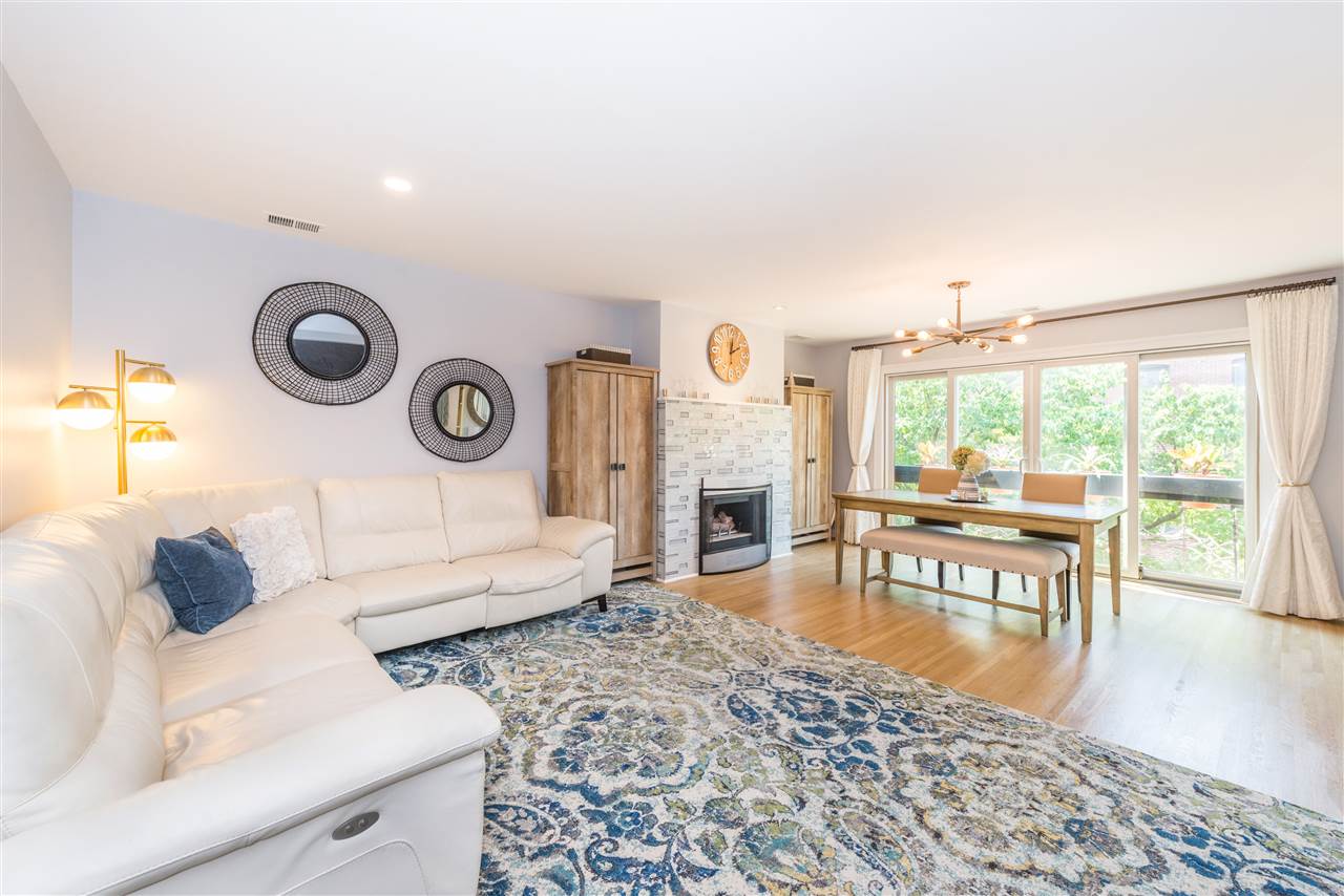 456 9th Street, Unit 48 Hoboken, NJ 07030 - Photo 1 of 1 a living room with furniture and a large window