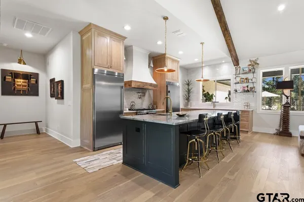 a bedroom with furniture and a large window