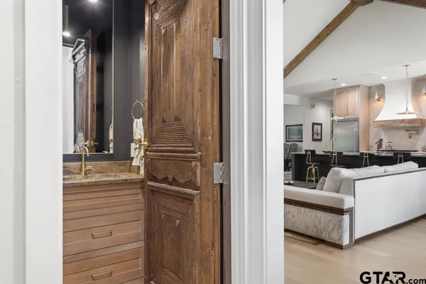 a bathroom with a sink toilet vanity and shower