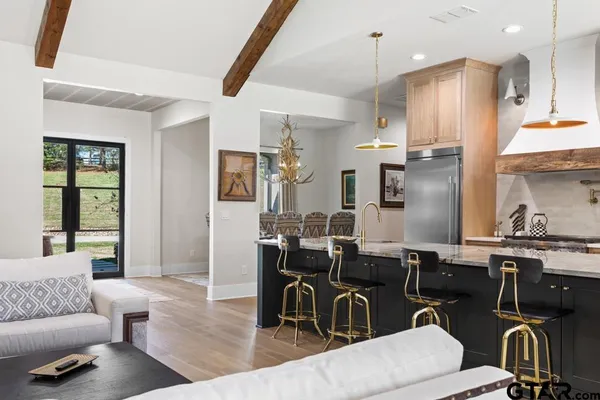 a view of a hallway with paintings on the wall