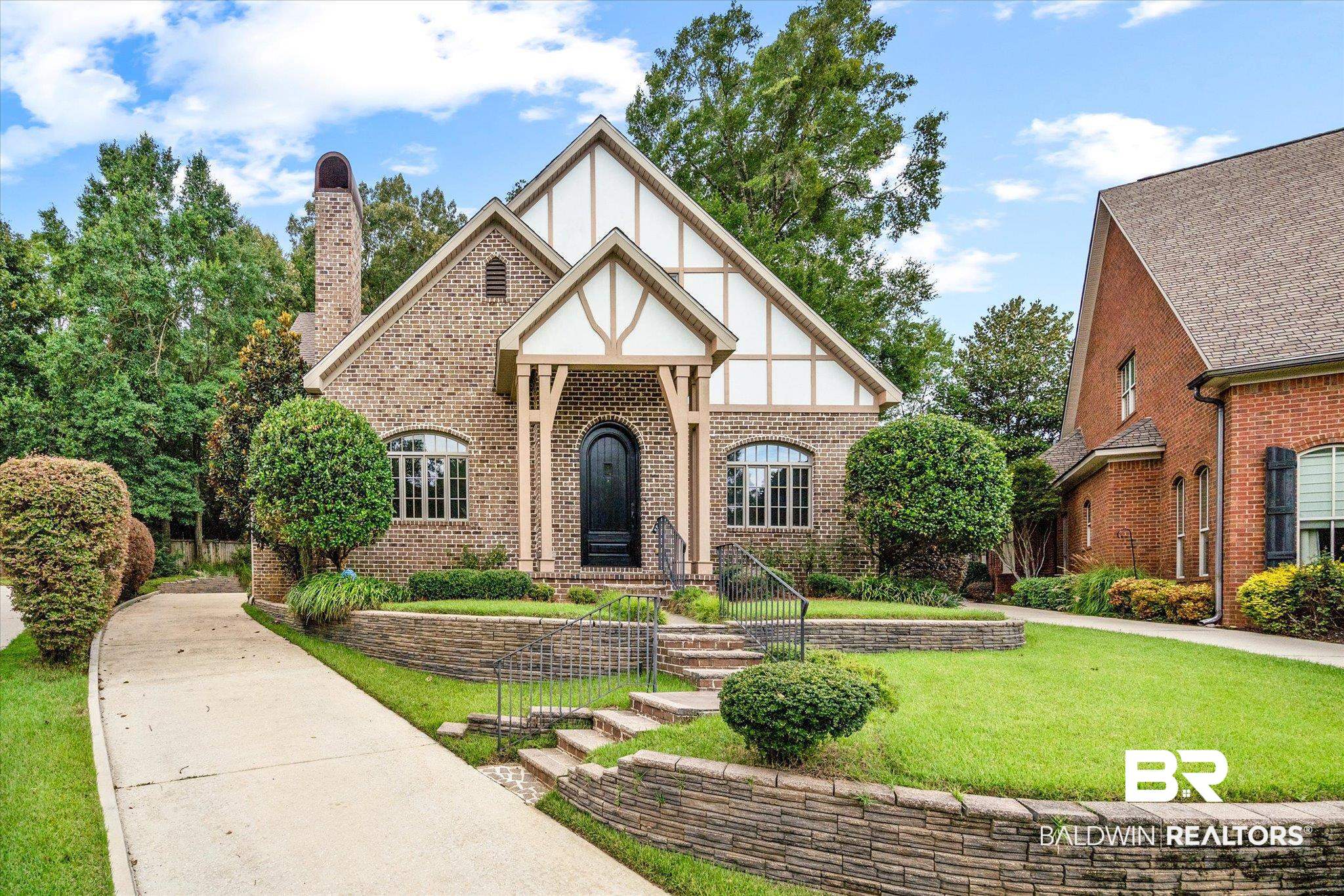812 Country Club Court Mobile, AL 36609 - Photo 1 of 34 Tudor-style house with a front lawn