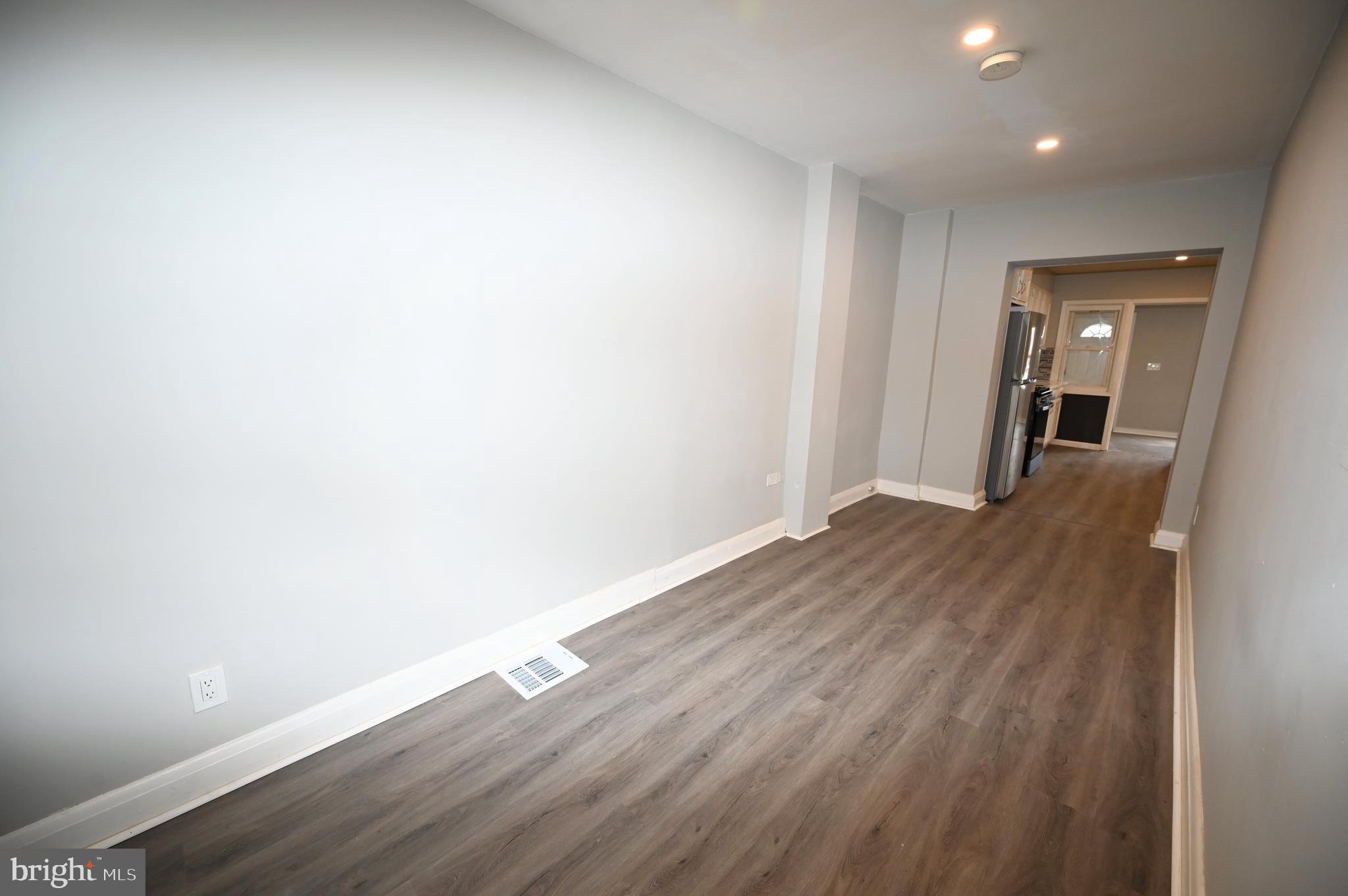 2952 Sollers Point Road, Unit B Dundalk, MD 21222 - Photo 19 of 37 a view of a room with wooden floor