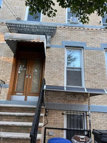 a view of staircase with a fireplace and potted plants