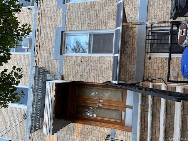 a view of staircase with a fireplace and potted plants