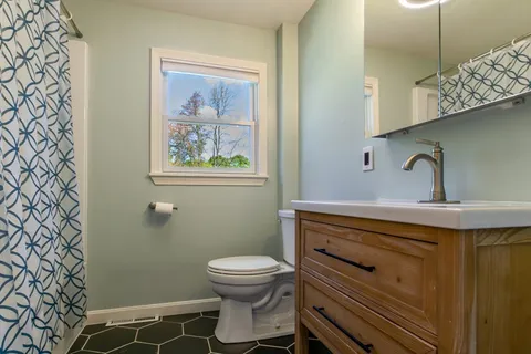 a bathroom with a sink and a toilet