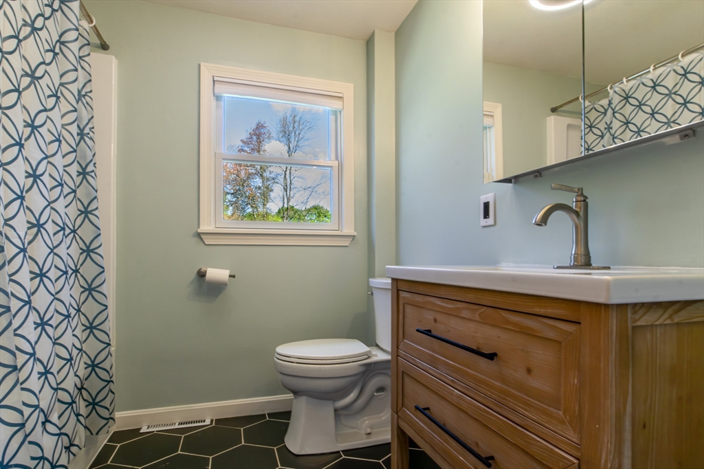 196 Center Street Groveland, MA 01834 - Photo 17 of 32 a bathroom with a sink and a toilet