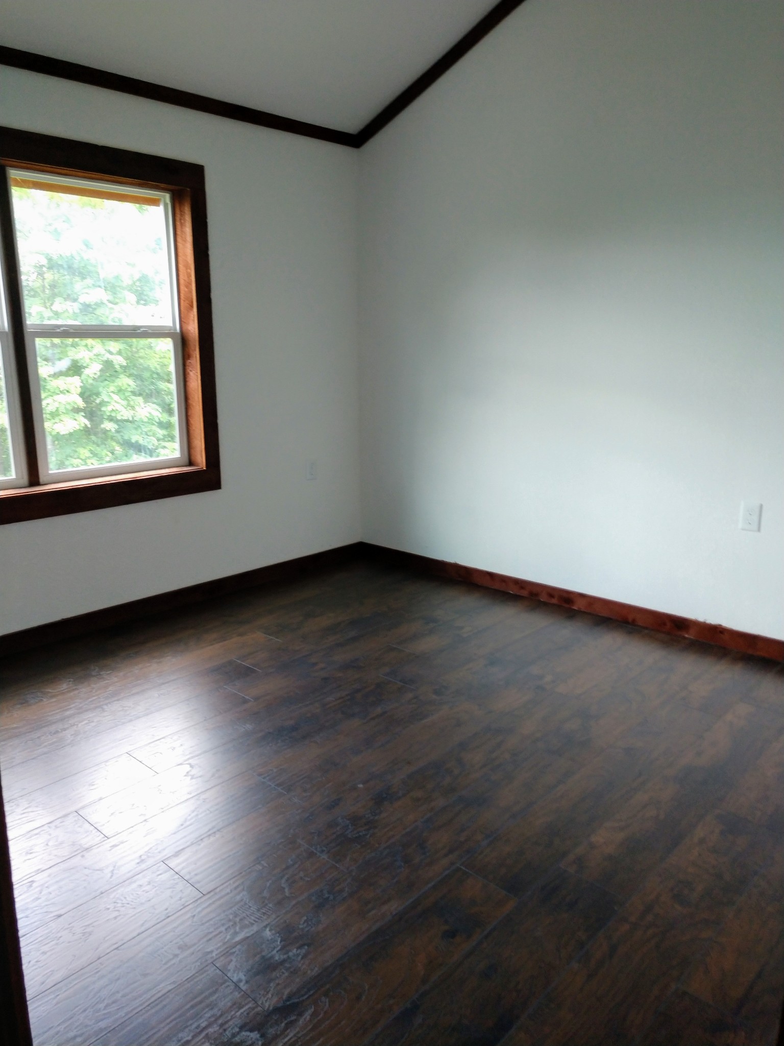 935 Poplar Flatt Road Silver Point, TN 38582 - Photo 16 of 33 an empty room with wooden floor and windows