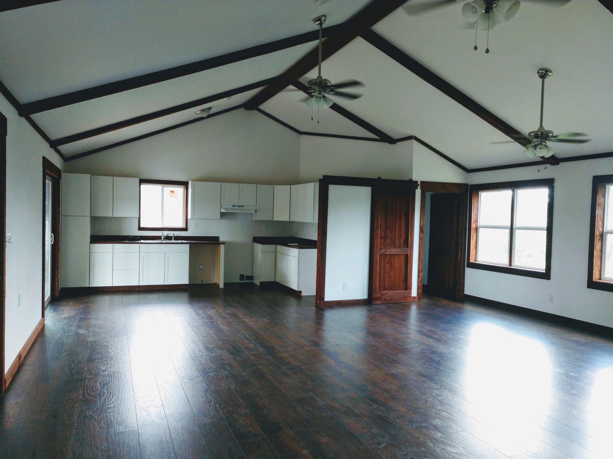 935 Poplar Flatt Road Silver Point, TN 38582 - Photo 20 of 33 an empty room with wooden floor and windows