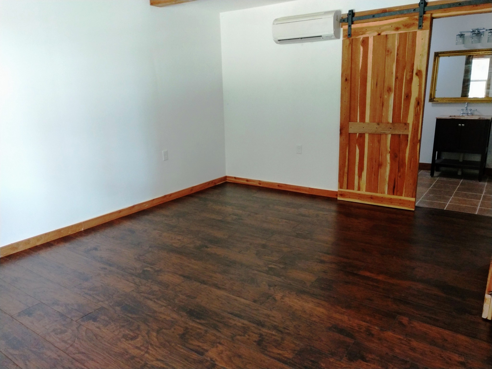 935 Poplar Flatt Road Silver Point, TN 38582 - Photo 3 of 33 a view of an empty room with wooden floor and a window