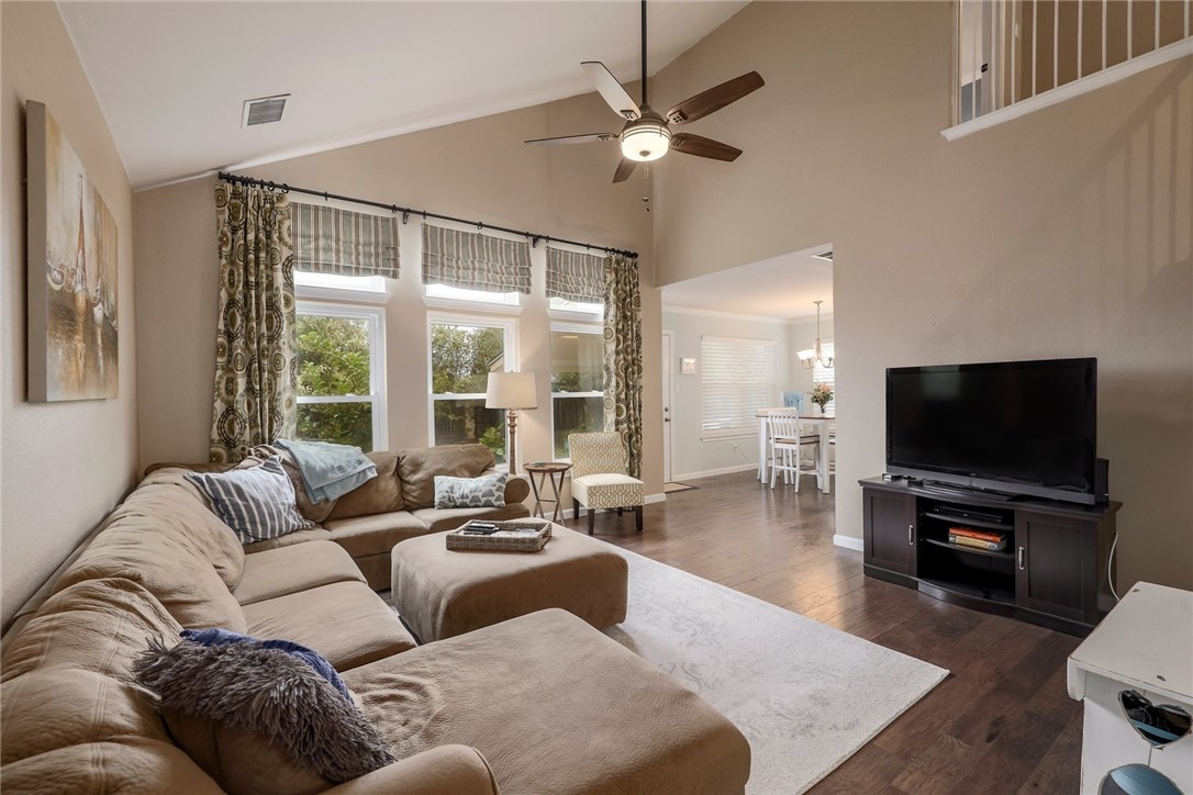 7908 Portland Trail Austin, TX 78729 - Photo 1 of 35 a living room with furniture and a flat screen tv