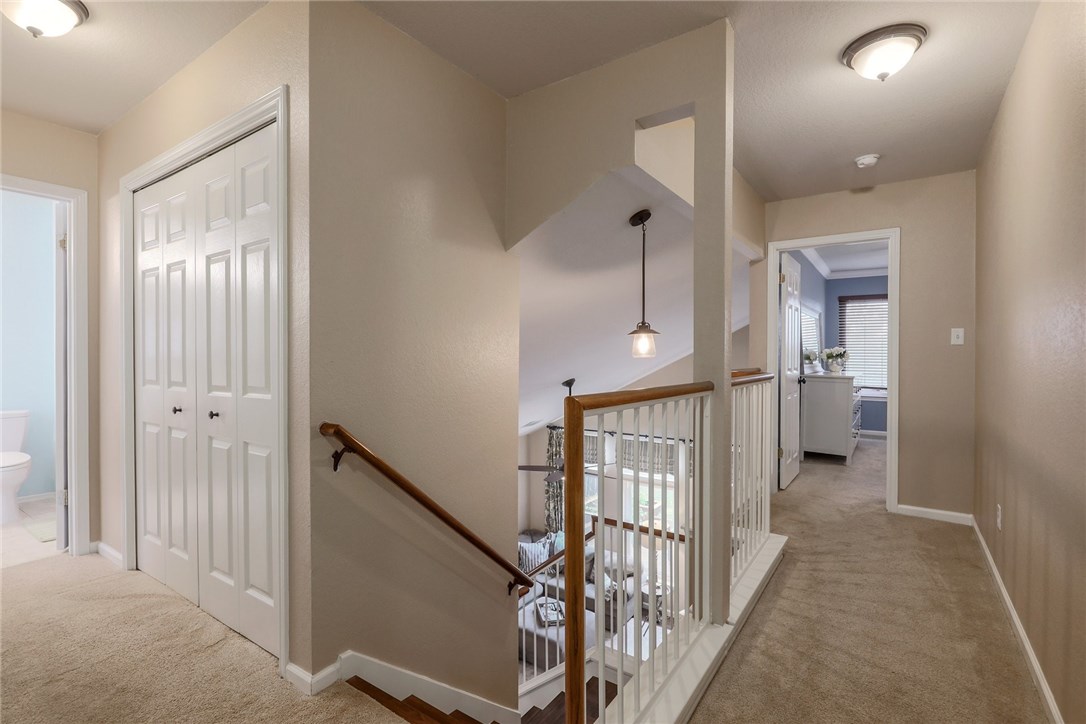 7908 Portland Trail Austin, TX 78729 - Photo 14 of 35 a view of a hallway with windows and stairs