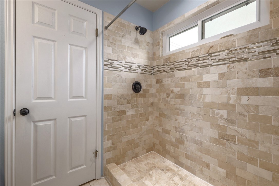 7908 Portland Trail Austin, TX 78729 - Photo 18 of 35 a bathroom with a shower