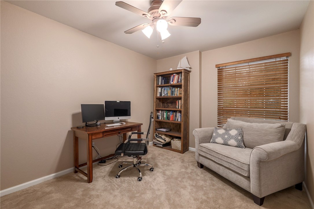 7908 Portland Trail Austin, TX 78729 - Photo 20 of 35 a view of a livingroom with workspace and a window