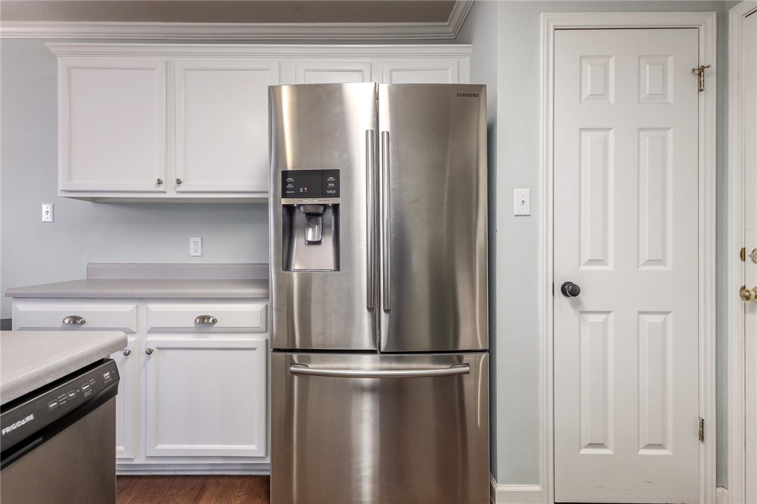 7908 Portland Trail Austin, TX 78729 - Photo 3 of 35 a white refrigerator freezer and a stove sitting inside of a kitchen