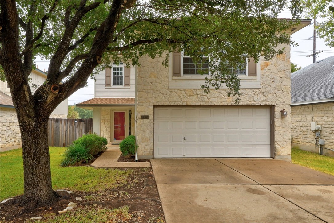 7908 Portland Trail Austin, TX 78729 - Photo 5 of 35 a front view of a house with garden