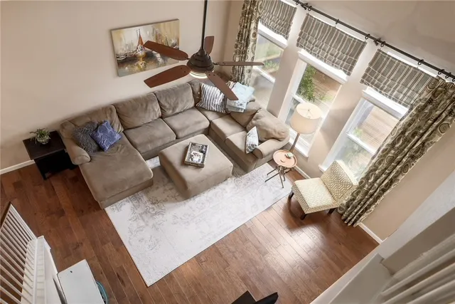 a view of living room with furniture and wooden floor