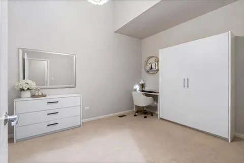 a room with a dresser and a mirror