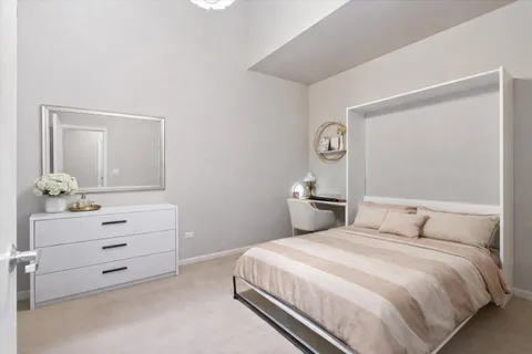 a bedroom with a bed and a dresser