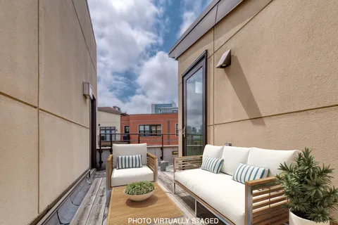 a view of balcony with furniture