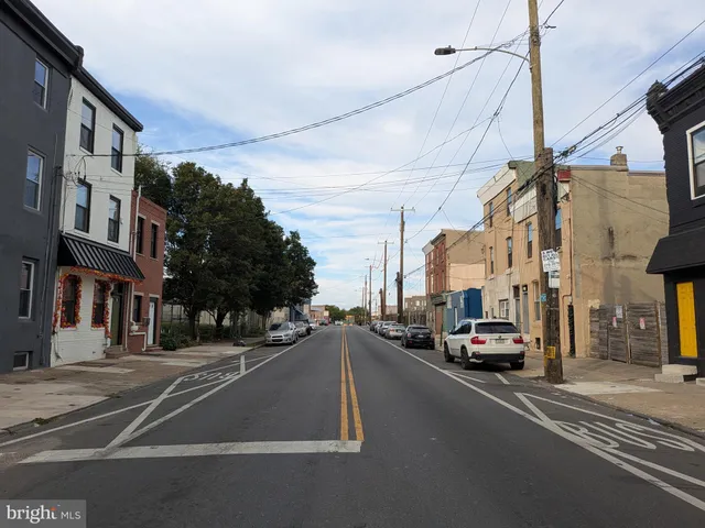a view of a city street with cars