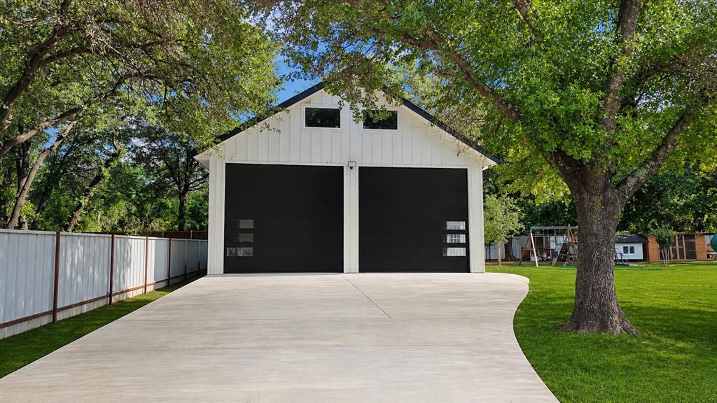 620 East 6th Street Springtown, TX 76082 - Photo 29 of 40 a front view of a house with a yard