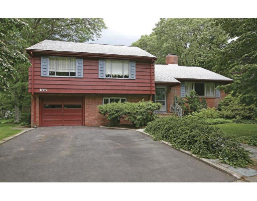 165 Paulson Road Newton, MA 02468 - Photo 1 of 7 a front view of a house with a garden