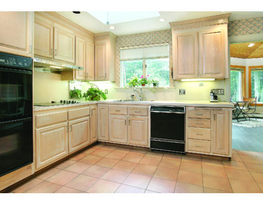 165 Paulson Road Newton, MA 02468 - Photo 3 of 7 a kitchen with a sink stove and cabinets