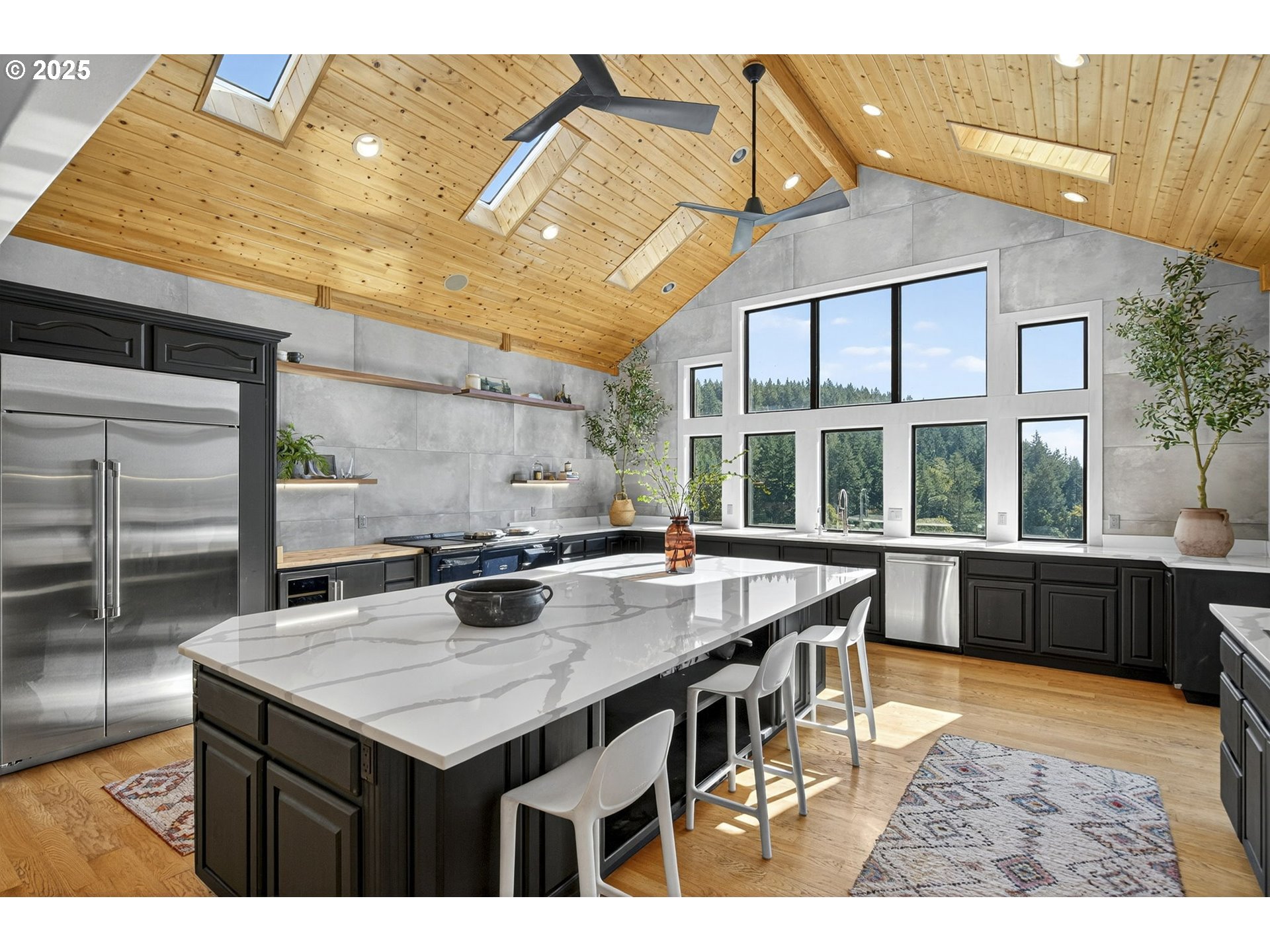 32520 Northeast Corral Creek Road Newberg, OR 97132 - Photo 12 of 48 a kitchen with a stove a sink and a dining table