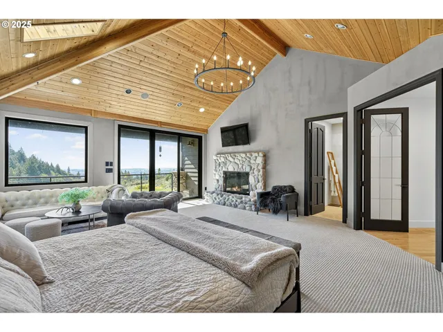 a bedroom with furniture and a large window