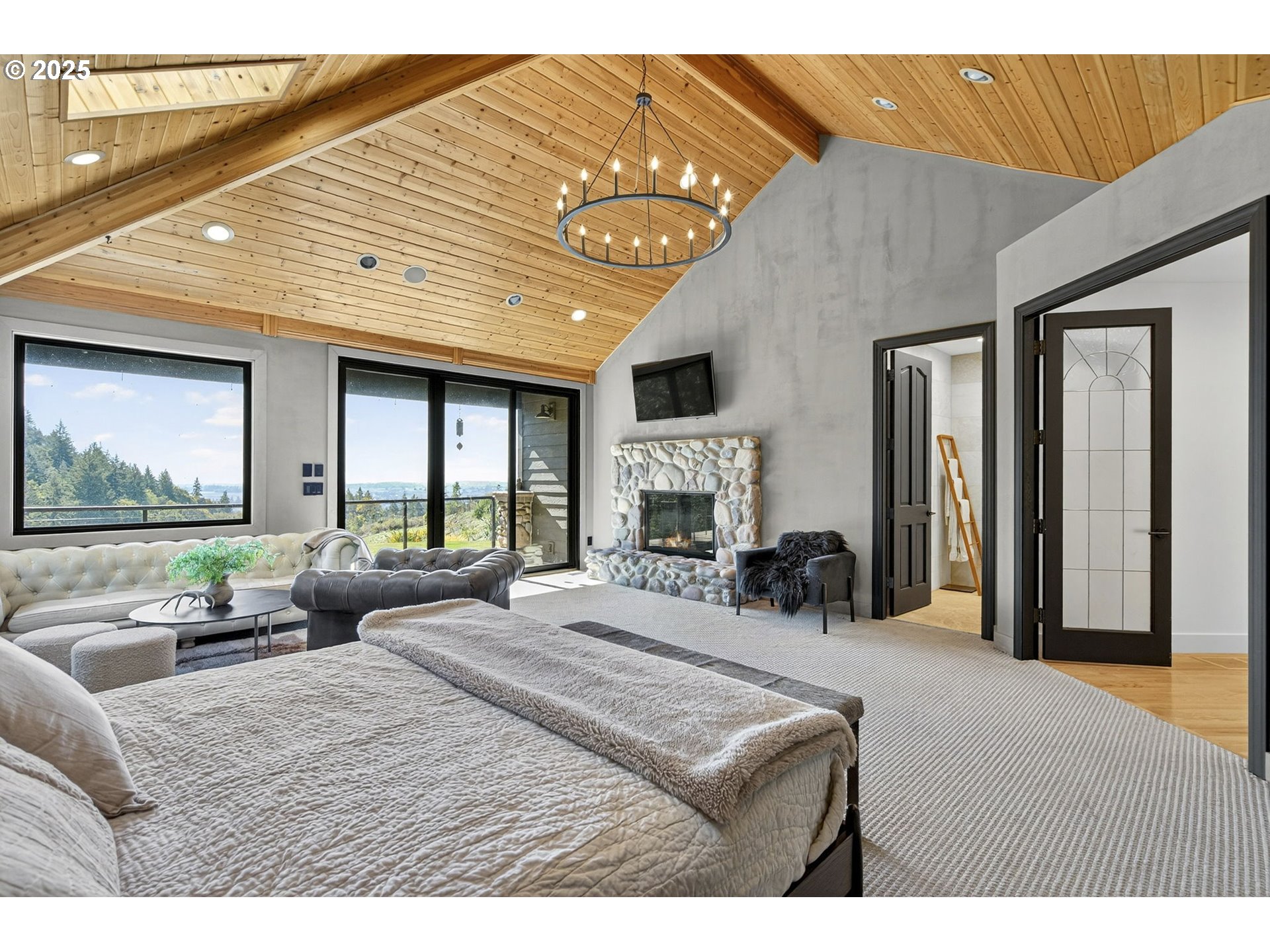 32520 Northeast Corral Creek Road Newberg, OR 97132 - Photo 18 of 48 a bedroom with furniture and a large window