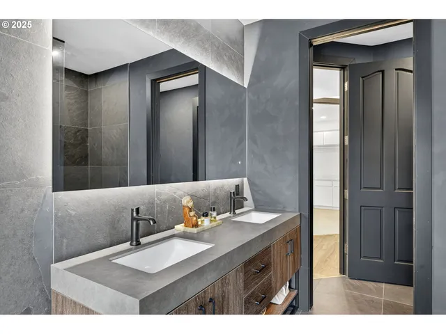 a bathroom with a sink vanity and a mirror