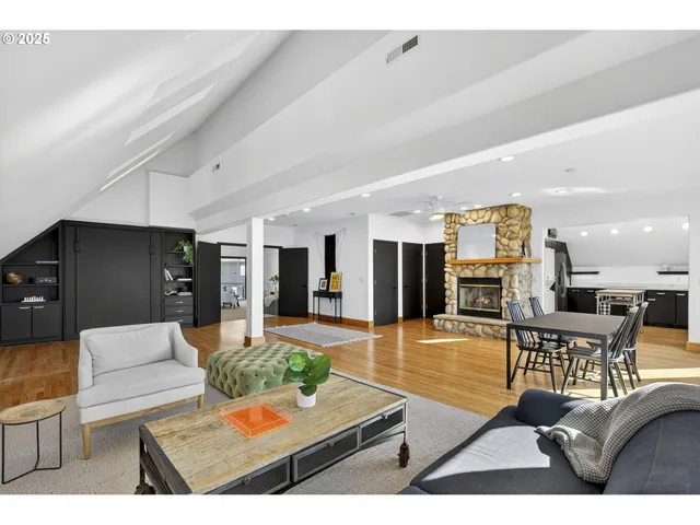 a living room with furniture and kitchen view
