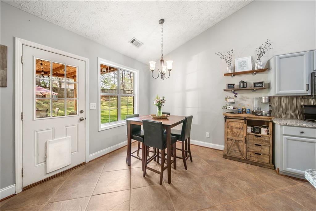 174 Foxtail Pass Acworth, GA 30101 - Photo 19 of 38 a view of a dining room with furniture window and outside view