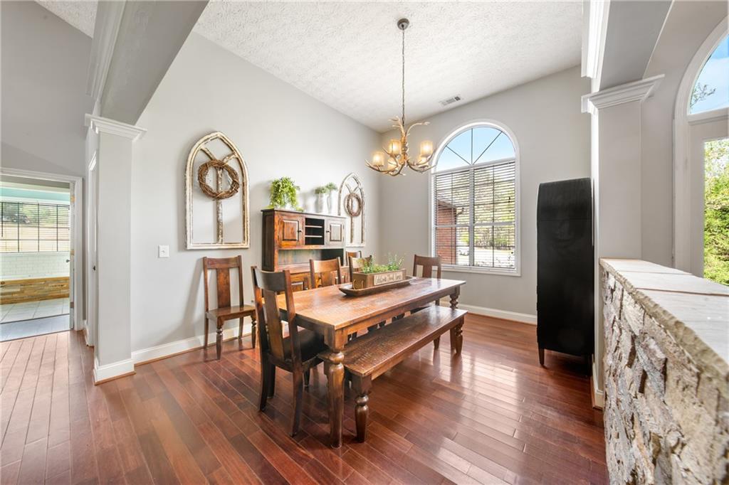 174 Foxtail Pass Acworth, GA 30101 - Photo 20 of 38 an open kitchen with wooden floor and large window