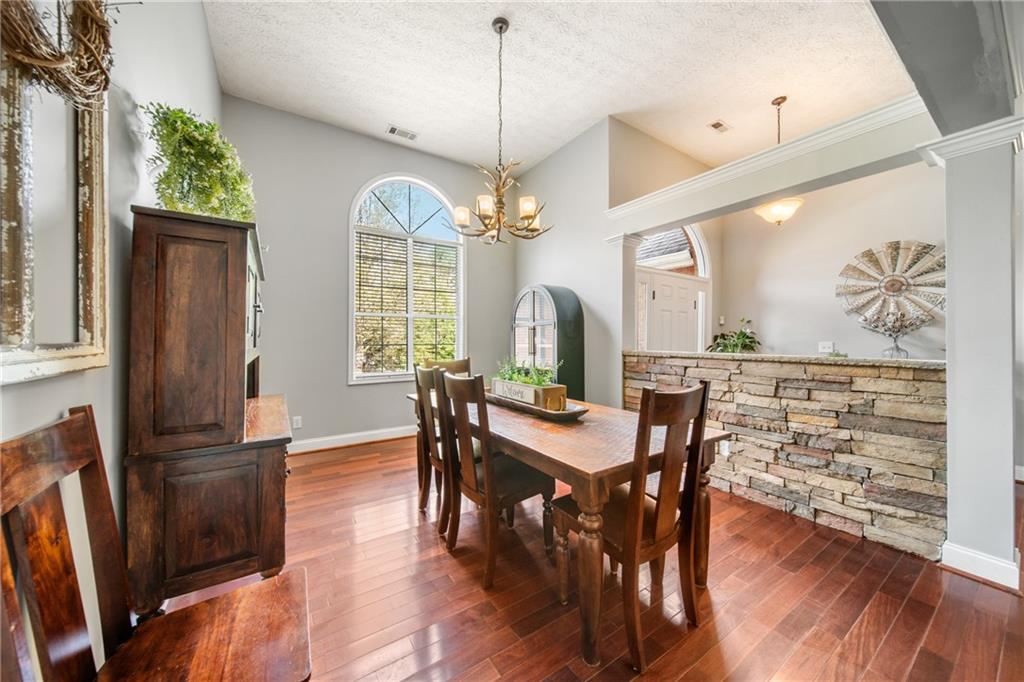 174 Foxtail Pass Acworth, GA 30101 - Photo 21 of 38 a view of a dining room with furniture window and wooden floor