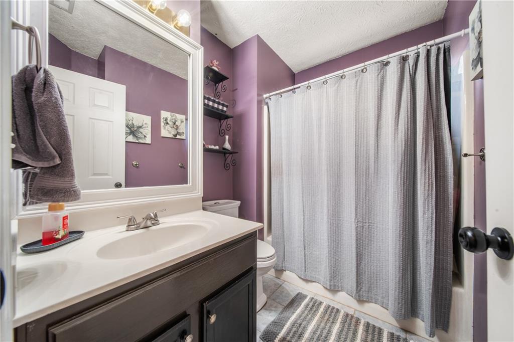 174 Foxtail Pass Acworth, GA 30101 - Photo 30 of 38 a bathroom with a sink and a mirror