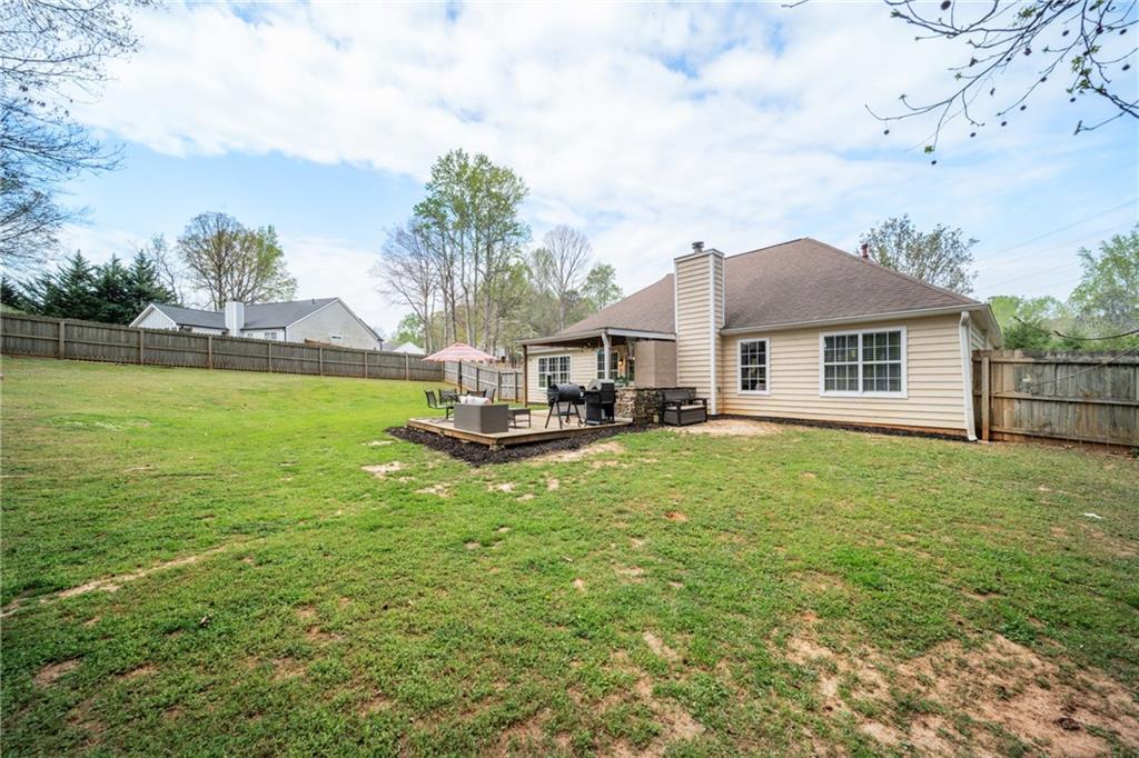 174 Foxtail Pass Acworth, GA 30101 - Photo 35 of 38 a house view with a garden space