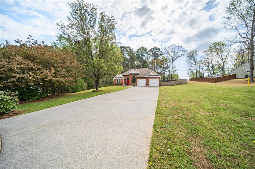 174 Foxtail Pass Acworth, GA 30101 - Photo 8 of 38 a view of yard with swimming pool and trees in the background