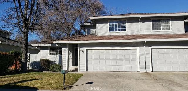 a front view of a house with a garage