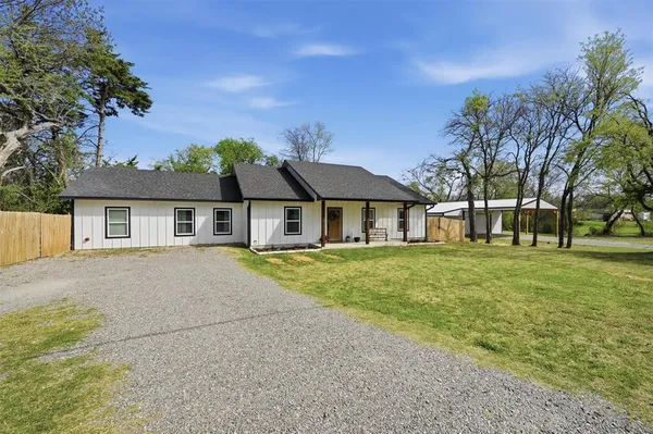 front view of a house with a yard