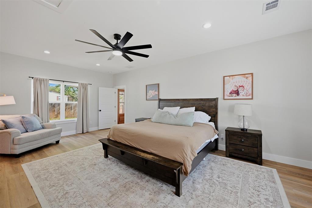 501 Bonham Street Tom Bean, TX 75491 - Photo 15 of 40 a spacious bedroom with a bed and couch