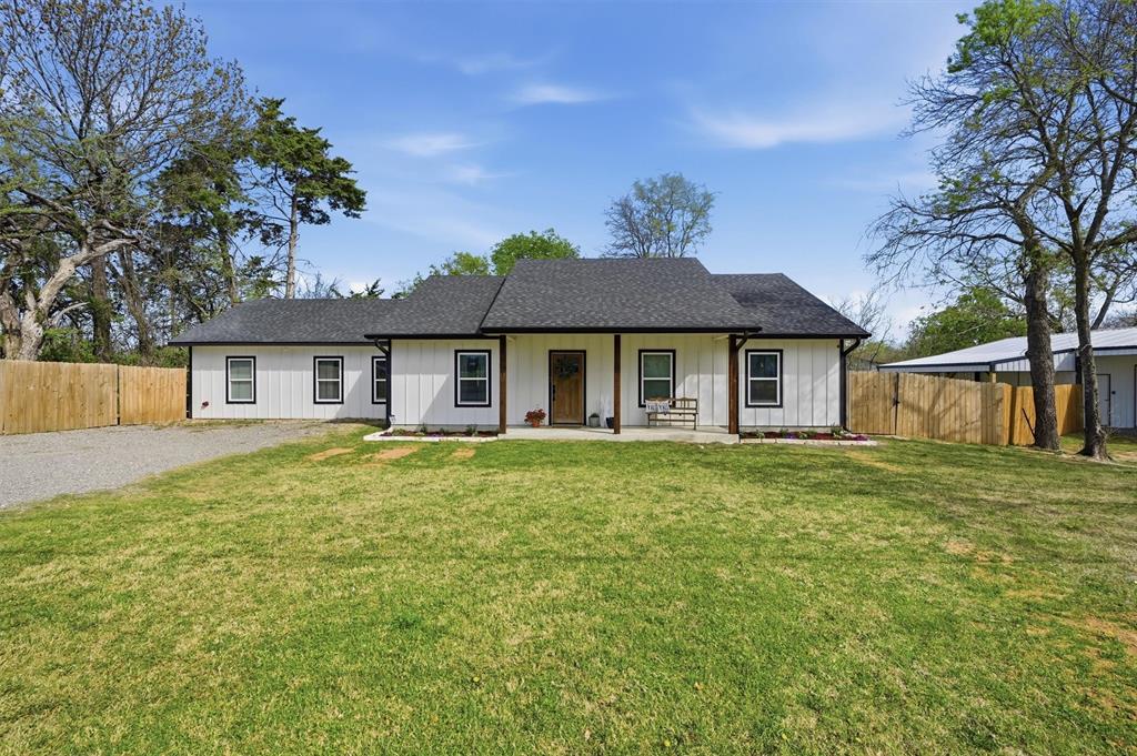 501 Bonham Street Tom Bean, TX 75491 - Photo 2 of 40 a front view of a house with a garden