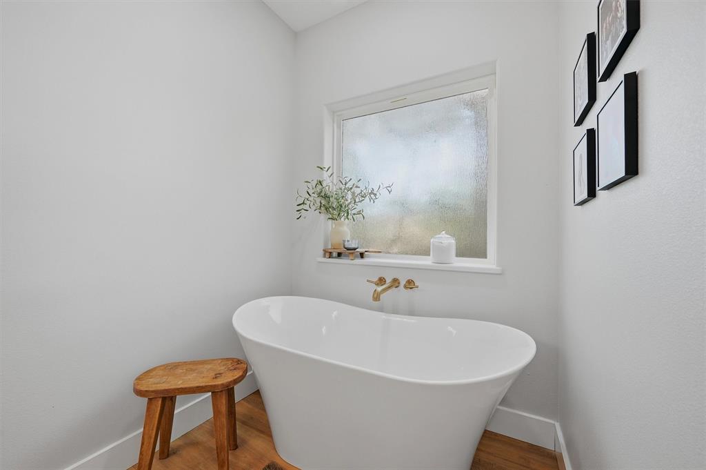 501 Bonham Street Tom Bean, TX 75491 - Photo 21 of 40 a white bath tub sitting in a bathroom