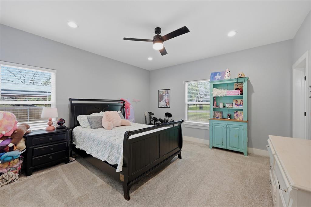 501 Bonham Street Tom Bean, TX 75491 - Photo 22 of 40 a bedroom with a bed and a window