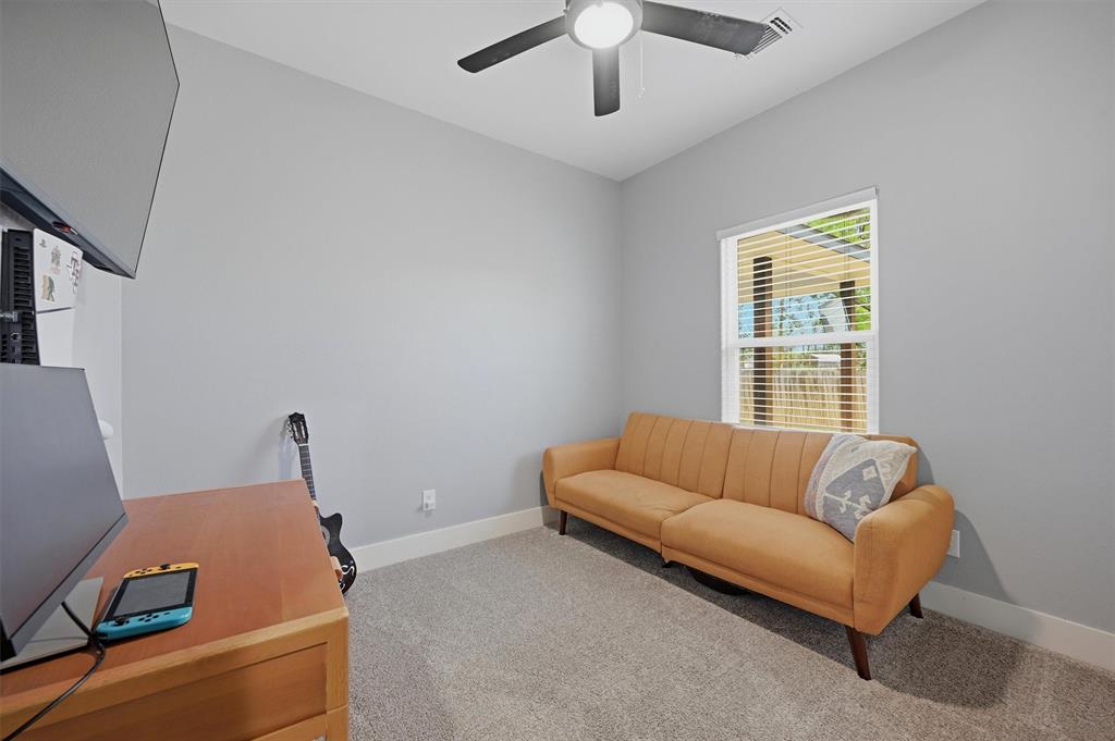 501 Bonham Street Tom Bean, TX 75491 - Photo 26 of 40 a living room with furniture and a window
